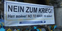 Banner "Nein zum Krieg! No to War!" Vor dem Saal des Westfälischen Friedens