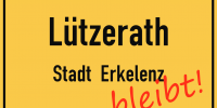 Luetzerath Ortsschild, mit "bleibt" in Rot.
